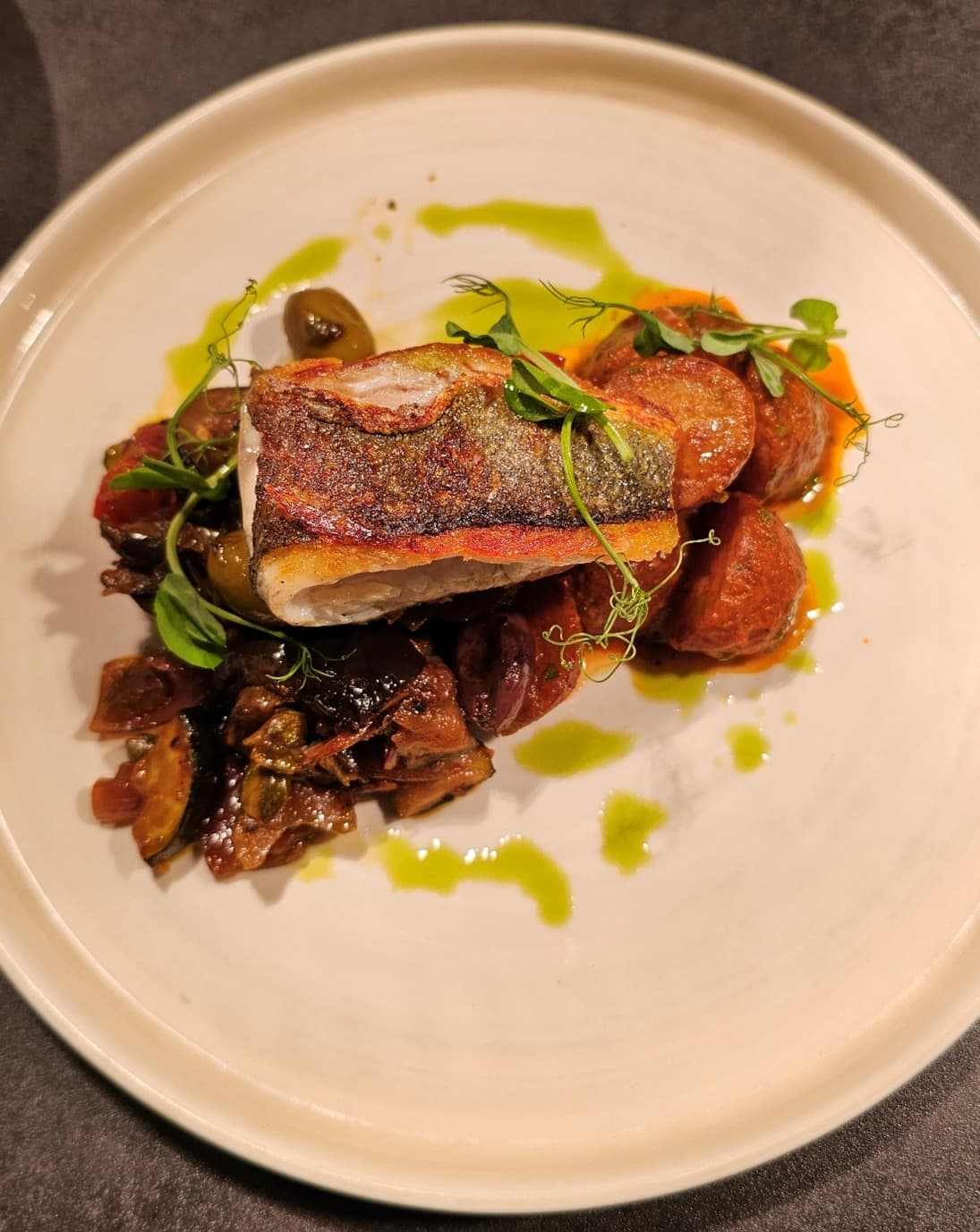 Pan seared sea bass with Mediterranean vegetables and potatoes bravas