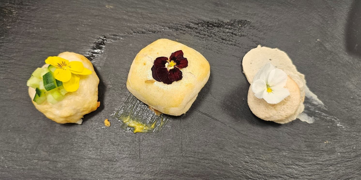 Gochujang chicken boa buns, miso beef wellington, and chestnut mushroom macarons.